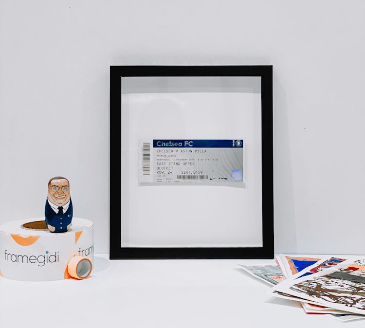 Football match ticket in a plexiglass frame