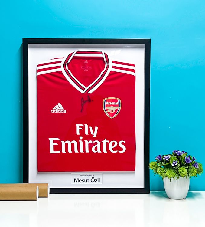 fly emirates jersey in a glass frame